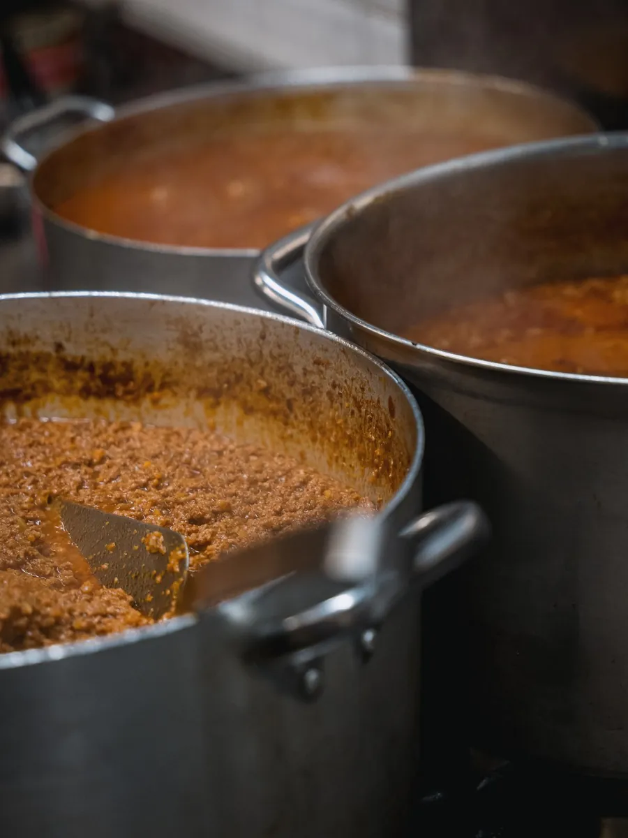 Bolognese ragù simmering in the pots at Le Moline